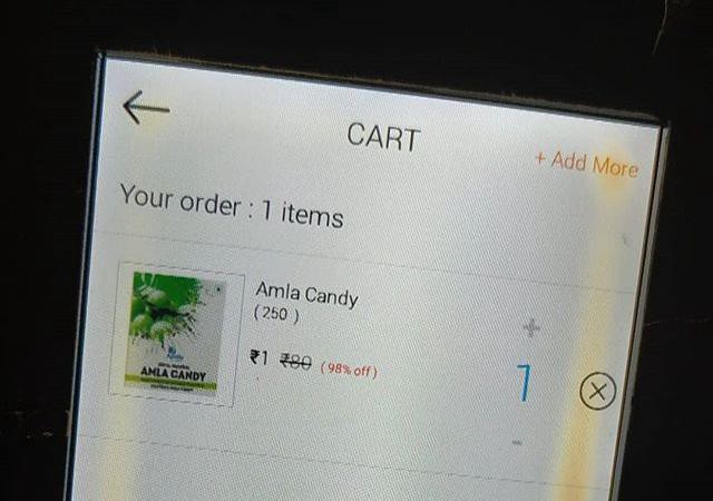 the app showing a discounted Amla Candy priced at ₹1